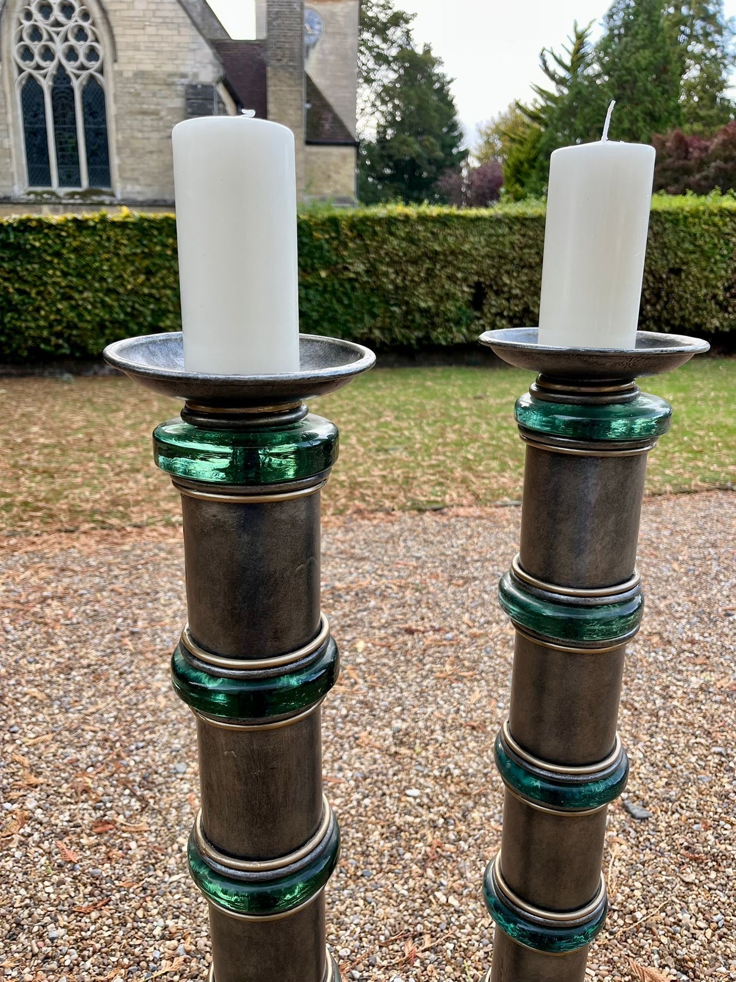 Impressive pair of 1950s Hollywood Regency chromed metal and green glass floor standing torcheres