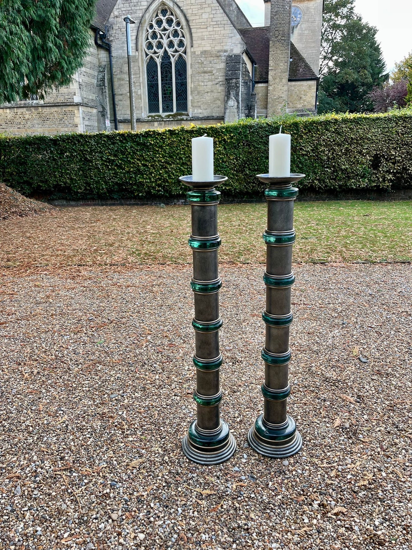 Impressive pair of 1950s Hollywood Regency chromed metal and green glass floor standing torcheres