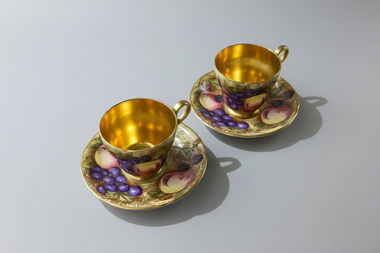 Beautiful pair of Aynsley Orchard Gold cups and saucers in mint condition, signed N. Brunt