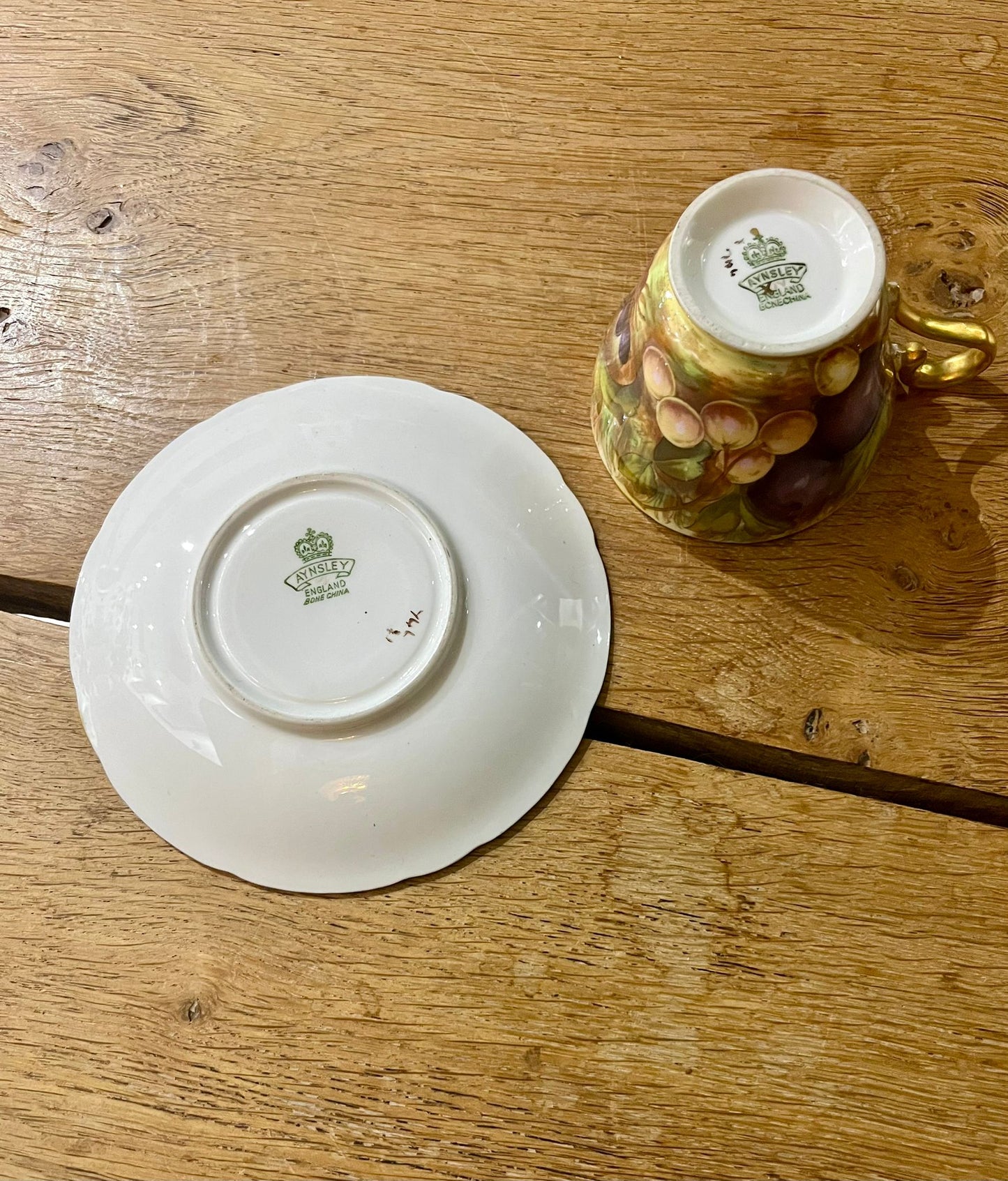 Beautiful pair of Aynsley Orchard Gold cups and saucers in mint condition, signed N. Brunt