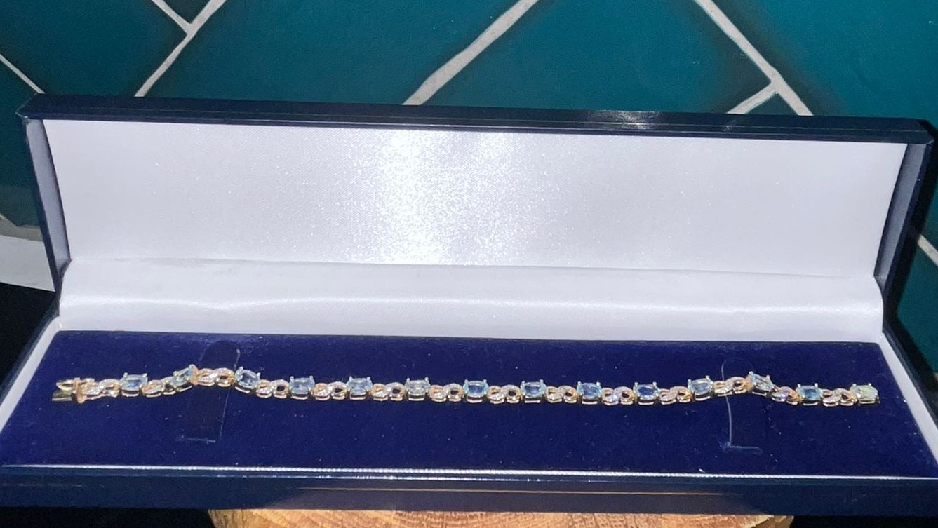 Stunning 9ct gold, blue topaz and diamond bracelet