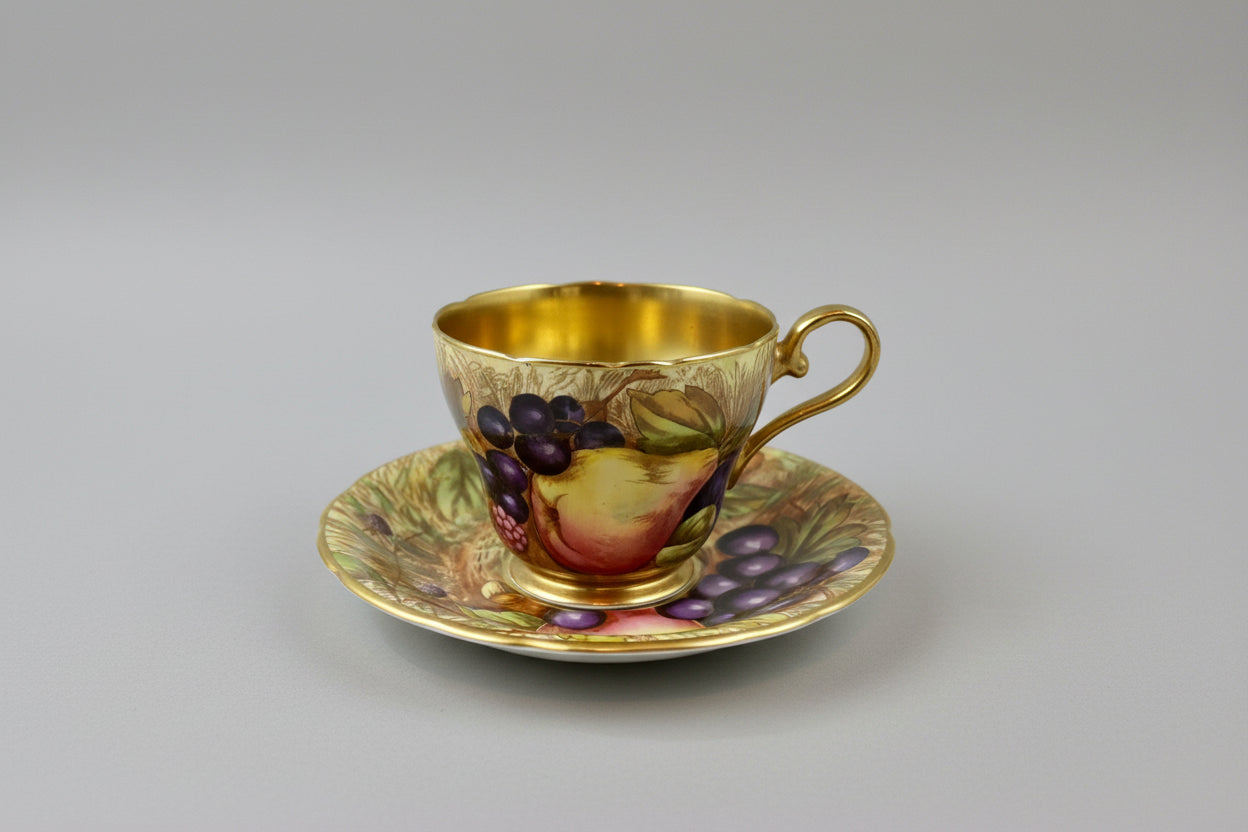 Beautiful pair of Aynsley Orchard Gold cups and saucers in mint condition, signed N. Brunt
