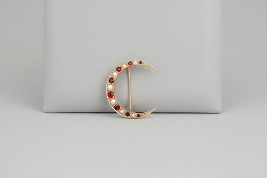 Antique 9ct gold ruby and pearl crescent brooch
