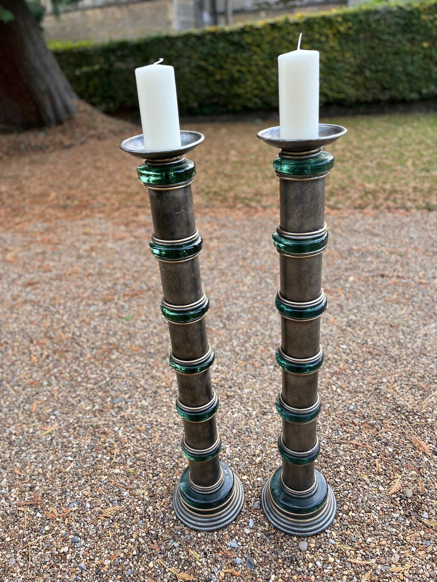 Impressive pair of 1950s Hollywood Regency chromed metal and green glass floor standing torcheres
