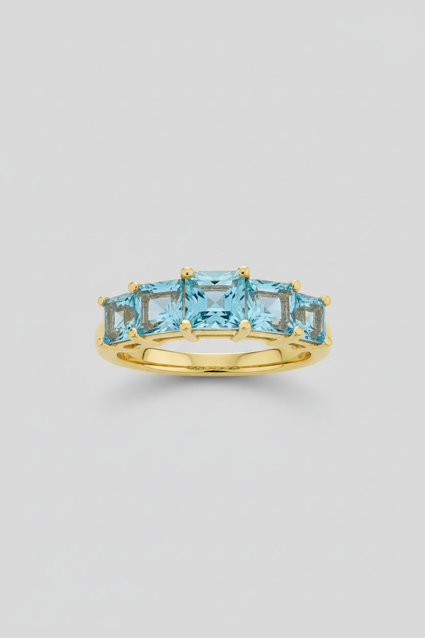 Beautiful 9ct gold and blue topaz trilogy ring
