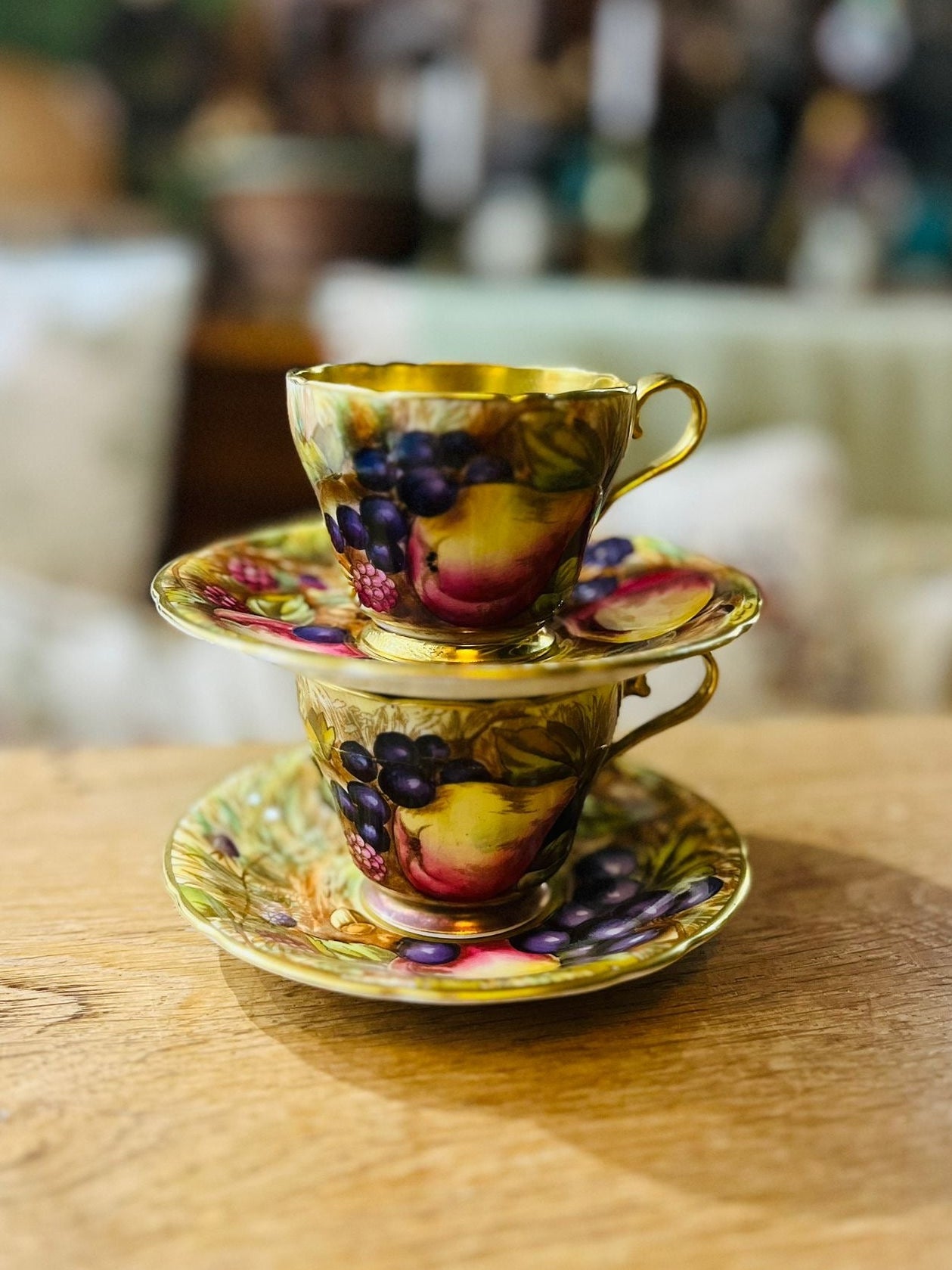 Beautiful pair of Aynsley Orchard Gold cups and saucers in mint condition, signed N. Brunt