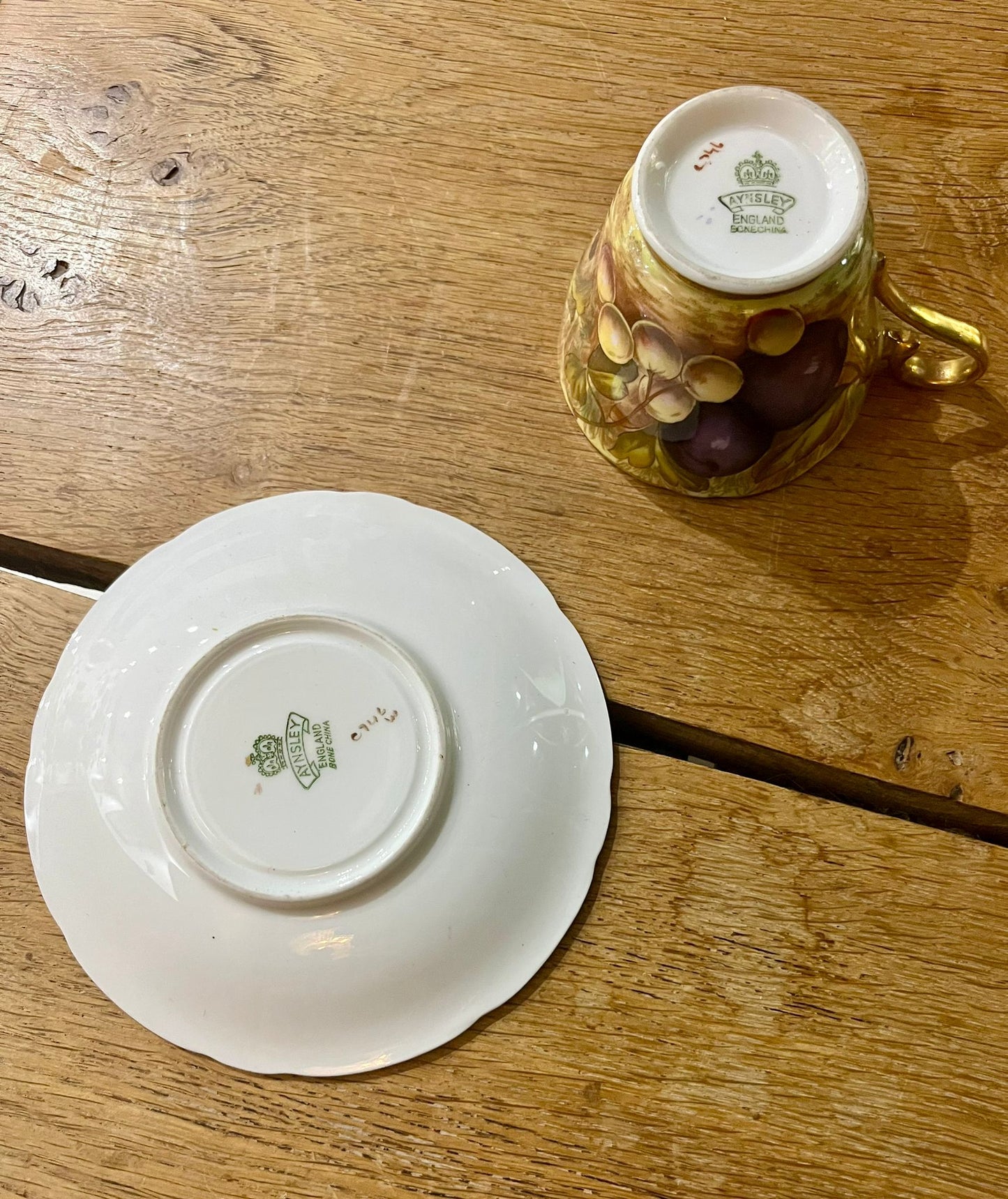 Beautiful pair of Aynsley Orchard Gold cups and saucers in mint condition, signed N. Brunt