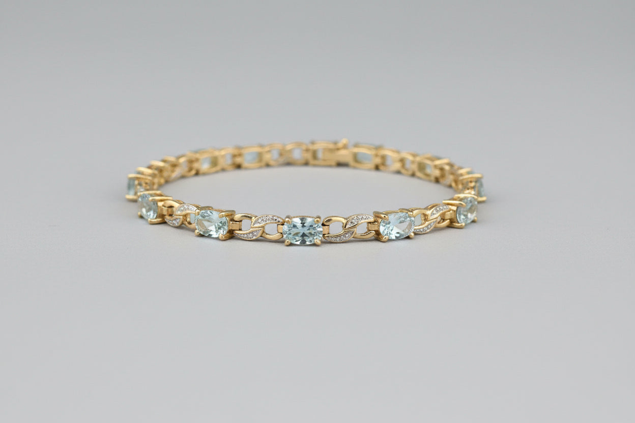 Stunning 9ct gold, blue topaz and diamond bracelet